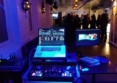 Holiday party guests singing karaoke with a Disc Jockeys Unlimited host