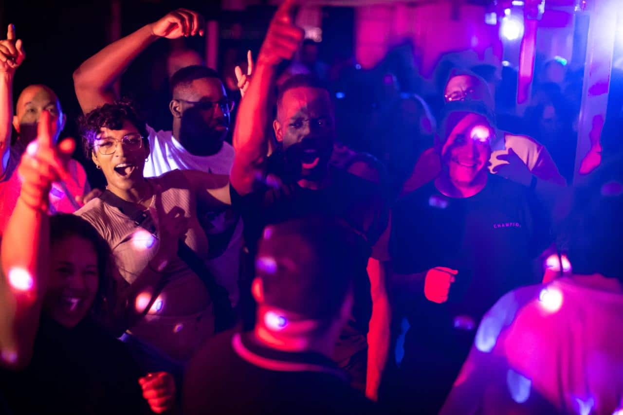 Professional DJ in Toronto – Disc Jockeys Unlimited Professional DJ performing at an event in Toronto with guests dancing and lights in the background